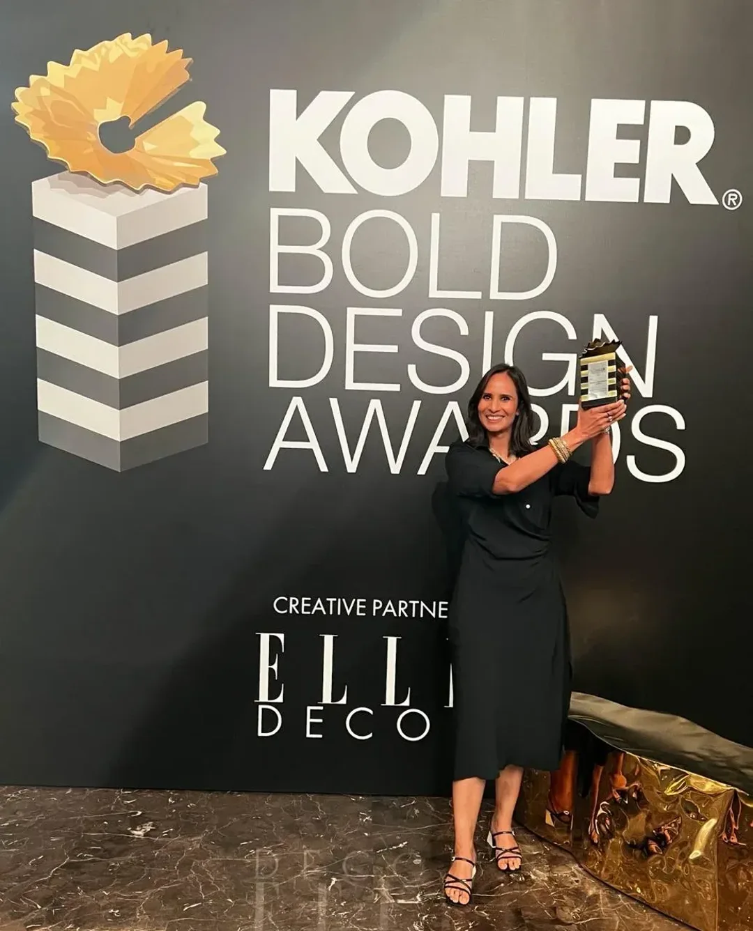 Sonia Gehlot with her trophy at the Kohler Bold Design Awards, creative partner Elle Decor